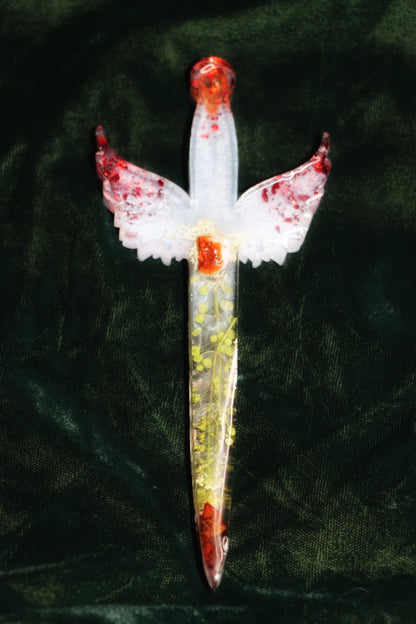 Phoenix Ritual dagger: radical transformation of self, leaving past self behind, identity shift